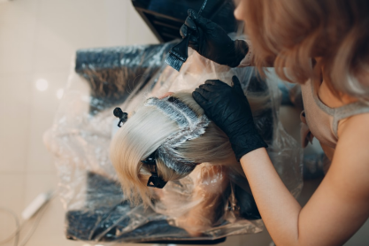 A person getting their roots colored 