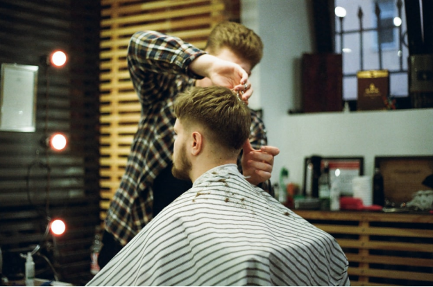 a barber cutting a man's hair