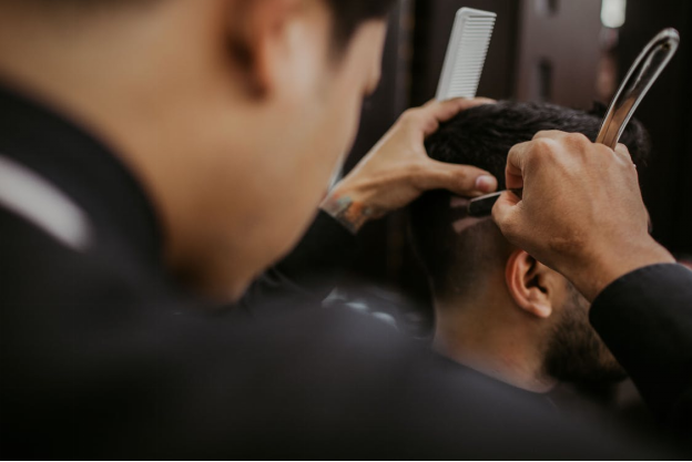 picture of a barber styling hair