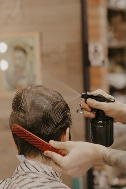 a person getting his haircut