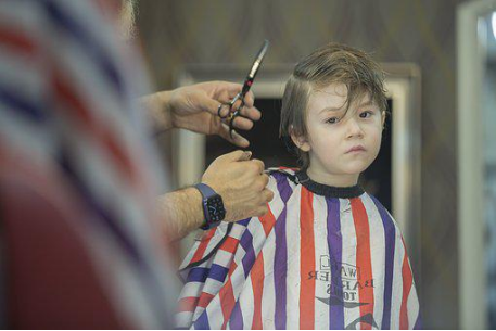 A toddler getting a haircut 